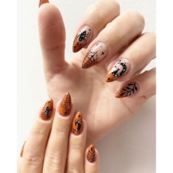 Vernis à ongles orange brûlé et astuces françaises avec des nail arts d’Halloween sur des ongles aiguilles moyens