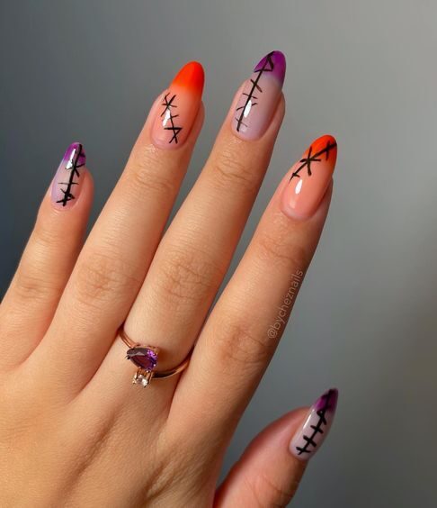 Embouts Français violets et oranges avec coutures design ongle sur ongles longs ronds